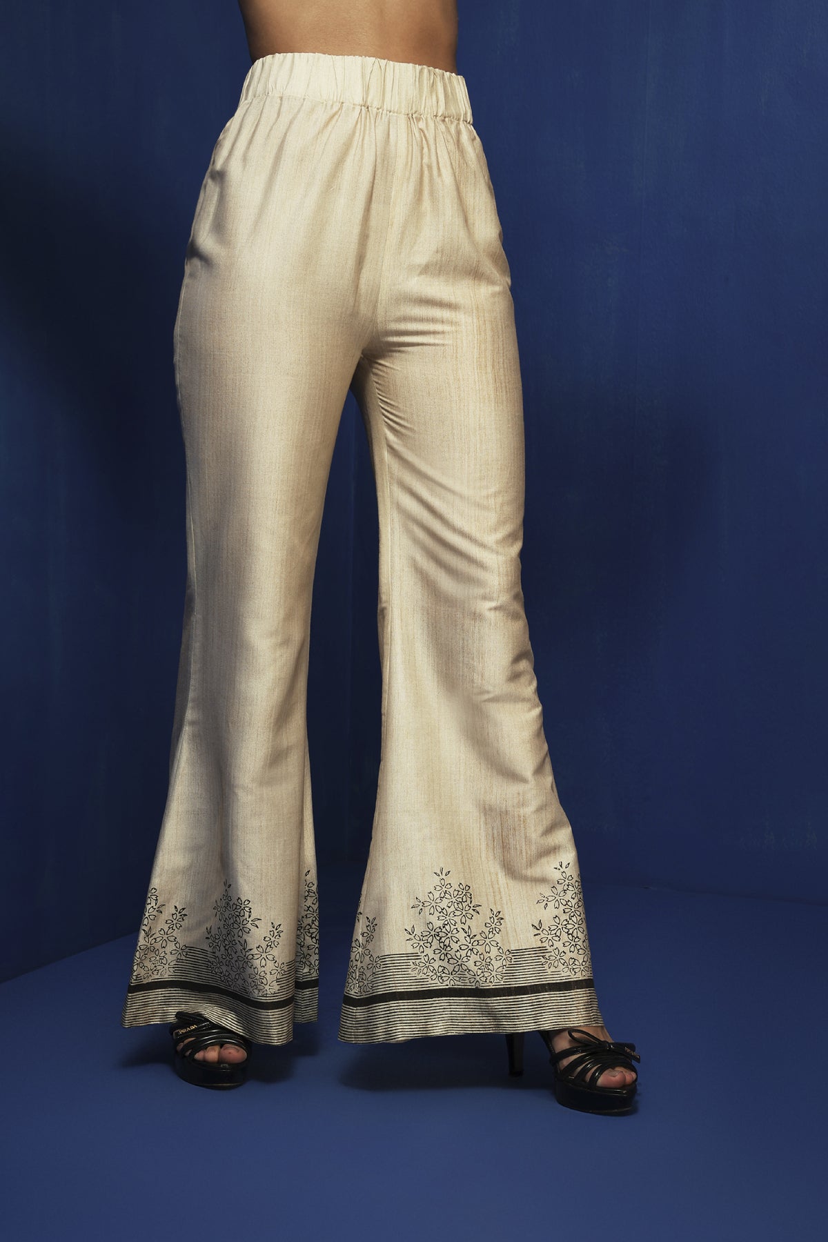 Ecru bell bottom pants