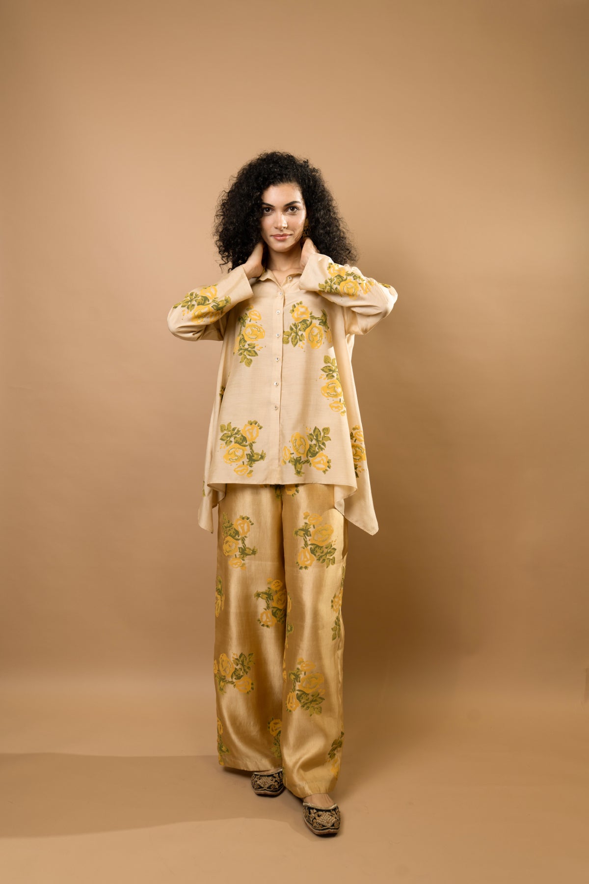 Beige rosettes block-printed asymmetrical hem shirt