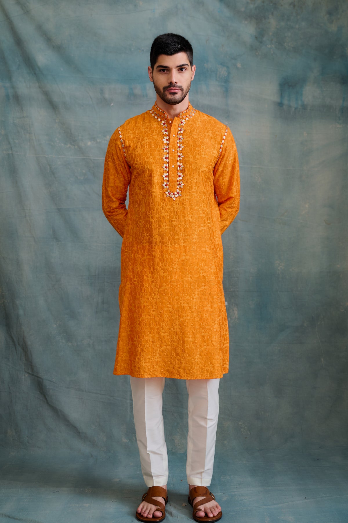 A vibrant orange all-over threadwork embroidery