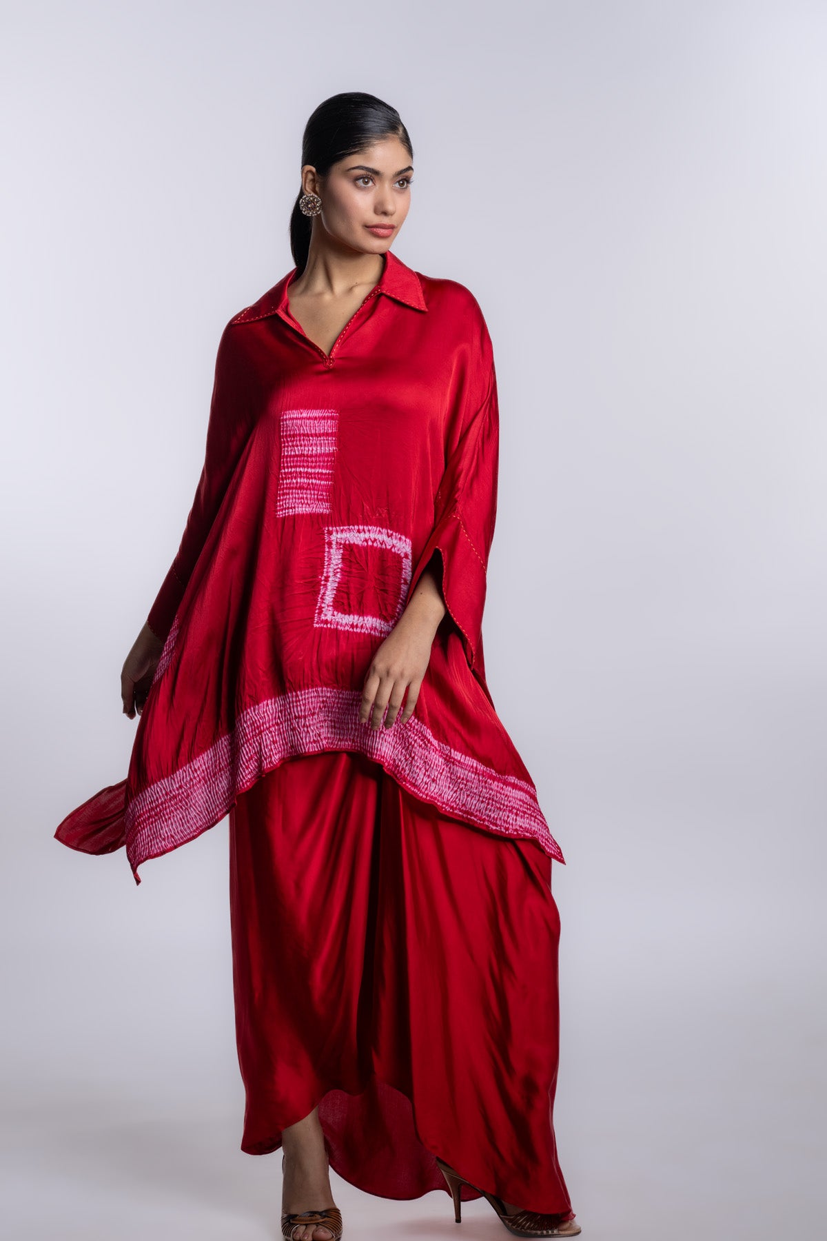 Red one-size kaftan top with an asymmetrical hem and a relaxed