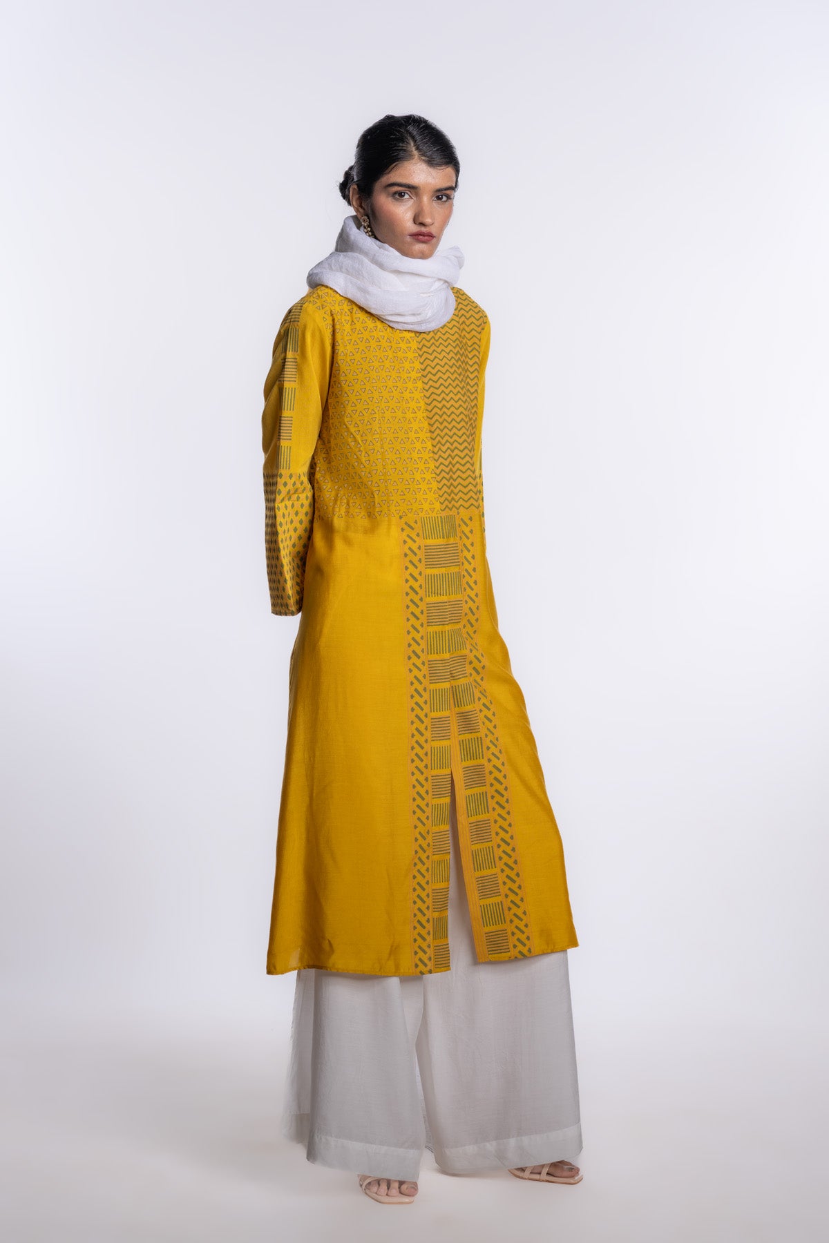 A front-open block printed tunic in warm mustard