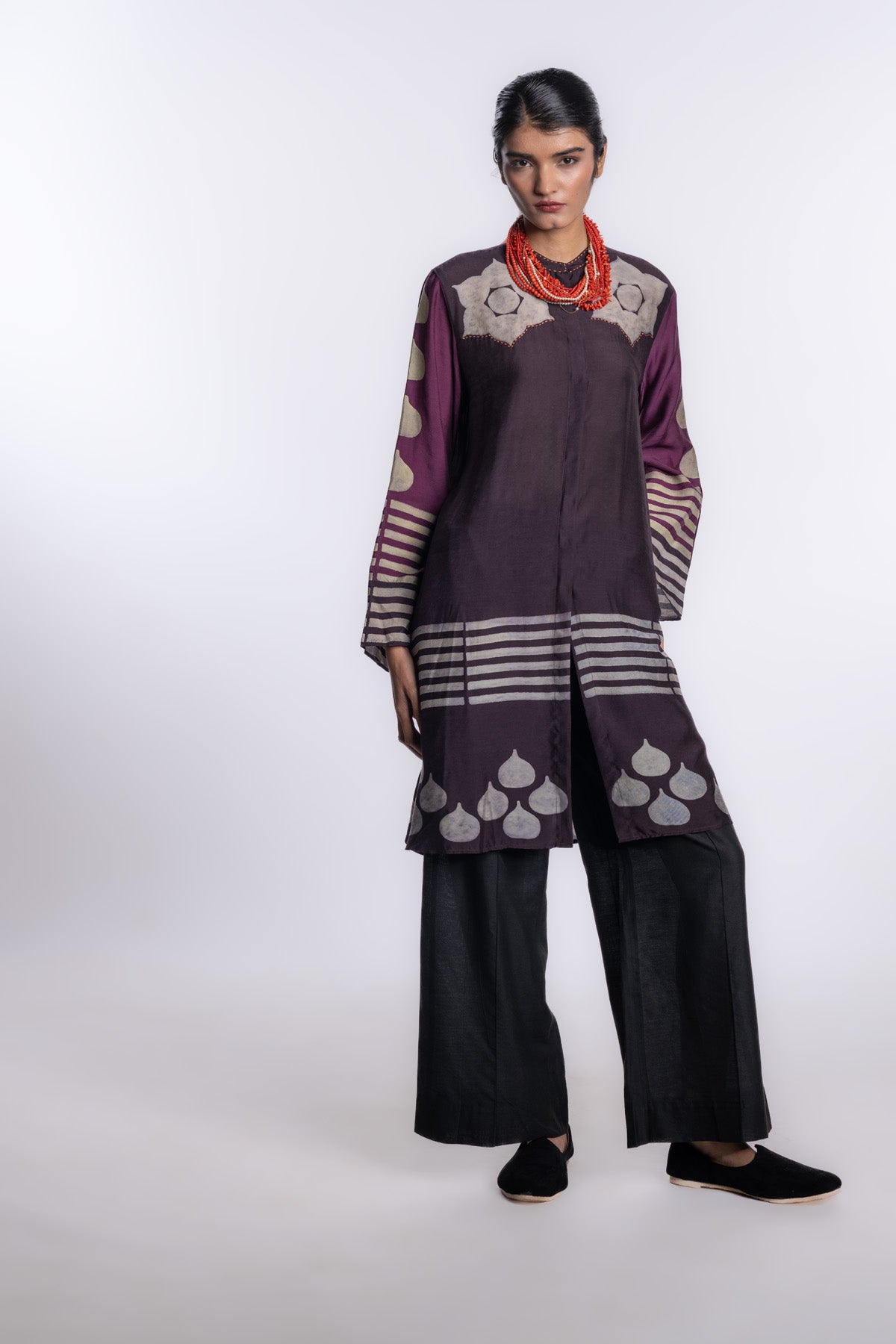 chocolate-brown tunic with deep plum sleeves